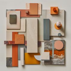 an abstract painting with orange, grey and white colors on it's surface is featured in this image