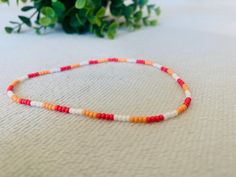 This multicoloured summer anklet is a cute accessory for any outfit and adds a pop of colour. It makes a great gift  for teens and adults. Trendy Colorful Beaded Anklets As Gift, Casual Multicolor Beaded Anklets, Trendy Multicolor Anklets As A Gift, Trendy Multicolor Anklets For Gift, Trendy Multicolor Anklets As Gift, Summer Red Beaded Bracelets With Letter Beads, Red Beaded Bracelets With Letter Beads For Summer, Casual Multicolor Round Beads Anklets, Casual Multicolor Anklets With Tiny Beads