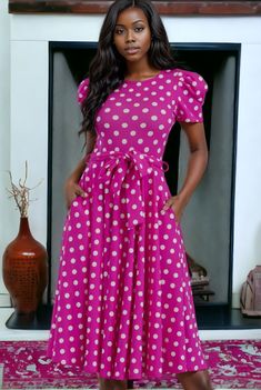 This polka dot print dress is a stunning addition to any wardrobe. The crew neckline and short puff sleeves give it a playful and feminine touch, while the midi length and waist tie provide a flattering silhouette. The dress is made of a combination of polyester and spandex, making it comfortable to wear and easy to move around in. The sleeves are 3/4 in length, perfect for any season. The back zipper closure and side pockets add practicality to this stylish dress. **PLEASE NOTE**This item requi Pink Midi Dress With Tie Waist And Short Sleeves, Dot Print Dress, Polka Dot Print, Dot Print, Stylish Dresses, Waist Tie, Puff Sleeves, Formal Event, Midi Length