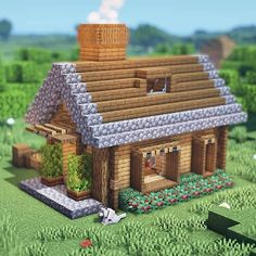 a house made out of legos in the middle of a field