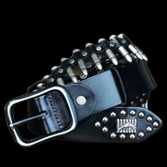 Rock 'n reload When you're shooting for that outlaw bandit look, it's time to rock this genuine leather belt that looks like a bandolier loaded with bullets.It comes in four colors and three sizes, and is also studded with skull and crossbones, and a design featuring a gun in front of a row of bullets.The buckle and bullets are metal alloy, and the belt is 3.8 cm (1.18 in.) wide.Rock it and you'll never run out of ammo, or have to ask yourself "did I fire six shots or only five?" Plays well with Outlaw Outfit, Black Metal Fashion, Belts Aesthetic, Rock Accessories, Bell Chimes, Bullet Belt, Jewelry Kpop, Belt Collection, Distressed Leather Belt