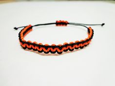 ------- Other Colors are available upon request--------- Micro paracord bracelet made from micro paracord It is made with black and orange colors This bracelet is fully adjustable and is easy to take on and off If purchasing please leave a tight measurement of your wrist in the comments of your order and we will add the appropriate amount of extra paracord to make your bracelet fit well Adjustable Black Braided Bracelet For Outdoor, Casual Black Braided Bracelets For Outdoor, Handmade Black Braided Bracelets For Outdoor, Adjustable Black Paracord Braided Bracelet, Casual Black Paracord Bracelet, Handmade Black Paracord Braided Bracelet, Duck Call Lanyard, Paracord Armband, Paracord Bracelet