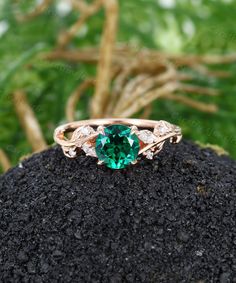 a green ring sitting on top of a pile of dirt