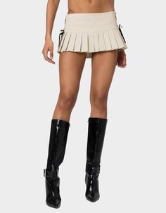 This Skort Is About To Become Your Next Go-To. With Its Pleated Design And Chic Ribbon Detailing, You'll Be Reaching For This Again And Again. Pair With The Matching Corset To Complete The Look. Mini Skort. Pleated Design. Ribbon Detailing. Matching Set. 100% Cotton. Model Wears Size S. Model Height Is 5'9. Item Care: Wash With Similar Color. | Edikted Margaret Pleated Ribbon Mini Skort Wwe T Shirts, Flannel Sweatshirt, Open Knit Sweater, Girls Blouse, Metallic Dress, Pleated Mini Skirt, Women Trends, Sweaters And Jeans, Kids Jacket