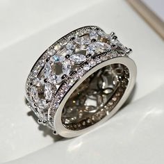 a wedding ring with three rows of diamonds