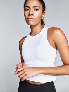 We work hard to ensure our range makes as little impact on the environment as possible; that’s why our motto is Less But Better. The Power Crop Tank is made from our Good Time Seamless fabric, which uses yarns that break down into organic matter within five years of being sent to landfill. Even the branding is eco-cons Functional White Tops For Everyday, Functional White Everyday Activewear, High Stretch White Cotton Activewear, White High Stretch Cotton Activewear, White Moisture-wicking Activewear, Versatile White Activewear For Everyday, White Activewear With Light Support, Less But Better, Sweaty Workouts