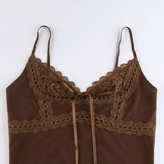 Nina Lace Trim Camisole The Nina Lace Trim Camisole by Alees Fashion is a perfect blend of elegance and comfort. Featuring delicate lace trims and a charming bow accent, this camisole adds a touch of sophistication to any outfit. The rich chocolate brown color enhances its luxurious appeal, making it ideal for layering or wearing on its own. Crafted from high-quality materials, it ensures a soft and comfortable fit for daily wear. Details - Material: High-quality fabric with lace trims- Color: C Spring Camisole With Contrast Lace And Spaghetti Straps, Spring Camisole With Spaghetti Straps And Contrast Lace, Chic Camisole With Contrast Lace, Lace Tank Top With Spaghetti Straps And Lace Trim, Elegant Lace Tank Top With Straps, Lace Cami Tank Top With Lace Trim, Sleeveless Lace Camisole With Lace Patchwork, Lace Patchwork Camisole Tank Top, Sleeveless Summer Camisole With Contrast Lace