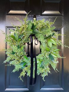 a wreath on the front door of a house