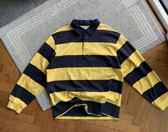 So sweet. Now is the time for the Ecko resurgance. They really have some hitter pieces dont sleep. Nice heavy polo Yellow and I think black or like dark dark ink horizontal stripes One cuff is kinda dirty, I just didnt wash before photoing since I didnt notice early I think it would easily come off in wash, Ill get it out if you buy and ask lol Tagged XL, its big but would look great oversized Measurements (In Inches - Laying Flat)  Chests: 25 in Length: 29.5 in Shoulder: 21.5 in Sleeve Length: 90s Style Yellow Long Sleeve Tops, 90s Yellow Long Sleeve Tops, Yellow Long Sleeve 90s Tops, Yellow Long Sleeve 90s Style Tops, Vintage Shirts Men, Drip Outfit Men, Dark Ink, Rugby Polo, 90s 2000s