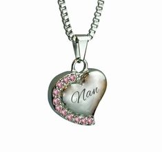 This beautiful piece of high quality jewellery is designed to hold a small amount of a loved one or pet's ashes, ensuring that there is always a part of them held close to your heart. This highly polished, solid 316L Stainless Steel pendant is in a heart shape with a line of pink crystals curved down the left side with " Nan " inscribed on it. Measuring approximately 2.8cm/1.10" in overall height and 1.8cm/0.70" in width. The solid 316L Stainless Steel 'box' chain measures approximately 51cm (20 Food Necklace, Urn Pendant, Urn Necklace, Urn Necklaces, Cremation Jewelry, Keepsake Jewelry, Gold Necklace Women, Memorial Keepsakes, Stainless Steel Pendant