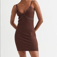 New Without Tags Short, Fitted Dress In Thick, Ribbed Jersey With Lace Details. Narrow Shoulder Straps, V-Neck At Front With A Small Bow, And A Lace-Trimmed Seam Below Bust. Fit - Fitted Composition - Polyester 94%, Spandex 6% Brown Ribbed V-neck Dress, Brown Stretch V-neck Bodycon Dress, Stretch Brown V-neck Bodycon Dress, Brown V-neck Ribbed Dress, Brown Bodycon V-neck Dress, Brown V-neck Bodycon Dress, Brown V-neck Dress With Lace Trim, Bodycon V-neck Mini Dress With Lace Trim, Brown Stretch V-neck Midi Dress