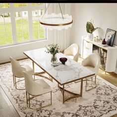 an elegant dining room with marble table and chairs