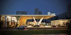 a gas station lit up at night with cars parked in front