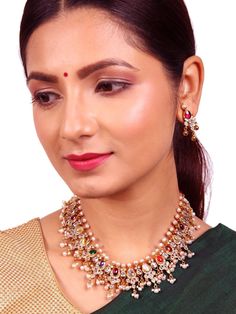 This beautiful short 925 silver gold polished Hasi necklace is adorned with stunning Navarathna stones and a bunch of fabulous pearls, making it an ultimate choice for weddings and traditional attire. This set also includes a perfect pair of earrings to complete the look and is suitable for kids as well. The stated price covers both the necklace and its matching earrings. Please refer to the pictures of the jewelry worn on a model to get a clear idea of the size. Condition: New. This product is San Ramon, Beautiful Shorts, Traditional Attire, Silver 925 Necklace, Gold Polish, Yellow Sapphire, Kids Jewelry, Bangalore, Indian Jewelry