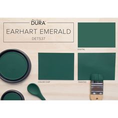 the paint colors are dark green, and there is a brush next to it