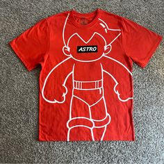 Southpole Astro Boy Graphic T-Shirt Men’s Short Sleeves Size Large Orange New Urban Style Short Sleeve T-shirt With Cartoon Print, Urban Style Short Sleeve Cartoon Print T-shirt, Urban Crew Neck T-shirt With Cartoon Print, Urban Cartoon Print Crew Neck T-shirt, Crew Neck Shirt With Cartoon Print For Streetwear, Casual Crew Neck T-shirt With Character Print, Urban Red Crew Neck Shirt, Red Crew Neck Top With Front Print, Sporty Cotton Tops With Cartoon Print