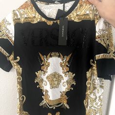 Versace T-Shirt Size 38. Brand New Luxury Crew Neck Summer Top, Luxury Crew Neck Top For Summer, Luxury Summer Crew Neck Tops, Luxury Graphic Print Tops For Summer, Luxury Black Summer Tops, Elegant Crew Neck Top With Graphic Print, Short Sleeve Graphic Print Tops, Luxury Short Sleeve Tops With Graphic Print, Elegant Short Sleeve Graphic Print Tops