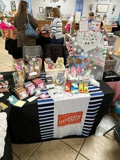 the table is covered with many items for sale