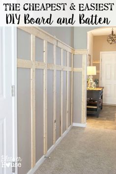 a room that is being remodeled with some wood framing on the wall and carpeted floor