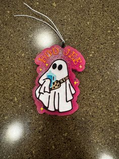 an ornament with a ghost on it