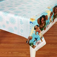 there is a table cloth with the image of moan and poohi on it