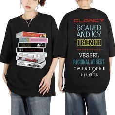 two people standing next to each other wearing t - shirts with cassettes on them