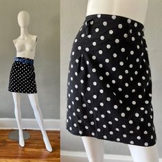 V I N T A G E 1980s . unlined . high waist . back zipper . belt loops . no pockets . amazing polka dot print . not much stretch . belt is NOT included C O L O R S . black | white M A T E R I A L . cotton L A B E L . a. byer C O N D I T I O N . excellent S I Z E . tag size // 11 . recommended size // s M E A S U R E M E N T S (not stretched) . waist // 27 . hips // 36 . length // 19 ** all items were measured laying flat & the measurements for waist, & hips have been doubled ** Party Polka Dot Lined Skirt, Polka Dot Mini Skirt With Lining, Relaxed Knee-length Polka Dot Skirt, Polka Dot Knee-length Flowy Skirt, Knee-length Polka Dot Flowy Skirt, Stretch Belt, Black High Waist, Polka Dot Print, Polka Dot