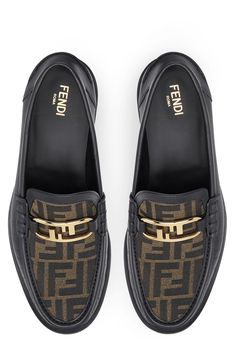 Offering a sleek, contemporary take on the label's iconic FF logo, O'lock hardware shines at the logo-jacquard vamp of a classic penny loafer. Leather and textile upper/leather lining and sole Made in Italy Men's Designer Shoes Fendi Loafers, Fendi For Men, Men’s Gucci Loafers, Luxury Black Semi-formal Loafers, Luxury Brogue-detailed Calf Leather Loafers, Ff Logo, Mens Designer Shoes, Penny Loafer, Penny Loafers