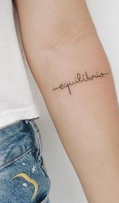 a person with a tattoo on their arm that says epileliane in cursive writing