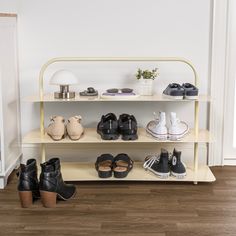 there is a shelf with several pairs of shoes on it