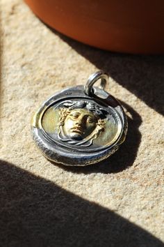 The Gordon, Medusa basking in the California sunshine. The silver medallion features a strip of 24K gold that is fused to create a one of a kind modern heirloom. Medusa Pendant, Eden Garden, Garden Restaurant, American Indian Jewelry, American Indian, Antique Jewellery, Indian Jewelry