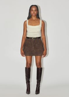 The Suede Skirt is a mini A-line skirt with pockets. With it's timeless shape and rich colour, this piece will be loved through out the seasons and years. Wear with The Oxford, or The Ribbed Tank. Suede Brown Skirt, Brown Suede Mini Skirt Outfit, Brown Suede Skirt Outfit, Suede Skirt Outfit Fall, Tan Skirt Outfit, Brown Mini Skirt Outfit, Suede Skirts, September Moodboard, Brown Skirt Outfit