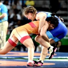 two women wrestle in a wrestling match