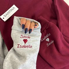 someone has painted their nails on the back of a sweatshirt that says jacli