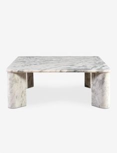 a white marble coffee table with two legs and a square shaped design on the top