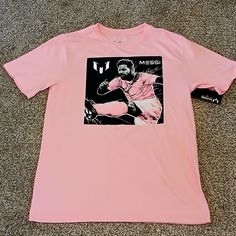 Messi Collection Inter Miami Soccer T-Shirt Boys Size: L Item Is Nwt. Please See All Attached Pictures. * Awesome Item For That Messi Fan! * Measurements: Pit To Pit 15" Top To Bottom 23.5" Sleeves 6.5" Thank You For Looking & Always Feel Free To Make A Offer! Casual Pink T-shirt For Fan Merchandise, Pink Top With Front Print For Fan Merchandise, Pink Sports Shirt With Graphic Print, Pink Sports T-shirt With Graphic Print, Pink Graphic Tee With Character Print, Sporty Pre-shrunk Pink Shirt, Pink Short Sleeve Shirt With Character Print, Pink Short Sleeve T-shirt With Front Print, Pink Pre-shrunk T-shirt For Fan Merchandise