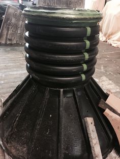 the top of a large black object is being worked on