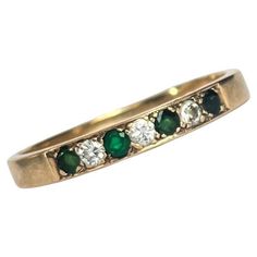 The emeralds in this ring are beautiful and deep green and measure 7pts each. In between the gorgeous green stones are diamonds which measure 7pts each also. The ring is modelled in 9carat gold. Ring Size: W 1/2 or 11 1/4 Band Width: 3.5mm Weight: 2.7g Green Stones, Eternity Band, Emerald Diamond, Emerald Ring, Wedding Looks, Green Stone, Deep Green, Eternity Bands, Eternity Ring