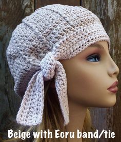 a crocheted hat with a bow on it's brim is shown in front of a mannequin head