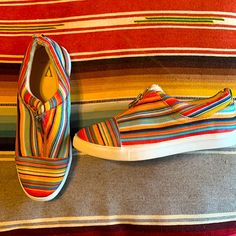 Never Worn Volatile Serape Slip On Shoes! With A 3/4 Zipper. Super Stylish! Comfortable Multicolor Slip-on Sneakers, Casual Multicolor Slip-ons For Spring, Trendy Multicolor Fall Sneakers, Multicolor Round Toe Sneakers For Fall, Casual Multicolor Slip-on Sneakers For Spring, Multicolor Slip-on Sneakers With Round Toe For Spring, Multicolor Flat Slip-on Shoes, Comfortable Multicolor Slip-on Sneakers For Summer, Multicolor Low-top Slip-on Sneakers For Summer