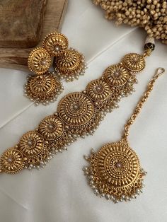 Real Gold look alike (gold imitation )tone  choker  comes with jhumka earrings  and tikka Earring length - 2 inches Style tip- ----------- Pair it with any beautiful traditional outfits  and flaunt with Unique style of collection from us. Perfect match for Festival and Traditional wear.  Take Care Tips-  ---------------- Kee away from perfume, Hair spray and. Moisture.  Store in dry place , Ziplock bag or Airtight box.    Clean with dry cloth.  Jewellery is the last thing you should wear and fir Luxury Latkans Jewelry Sets For Diwali, Luxury Festive Tilla Chandbalis, Affordable Temple Jewelry For Diwali, Cloth Jewellery, Antique Gold Jewellery, Punjabi Jewelry, Kundan Jewelry, Antique Jewelry Indian, Ziplock Bag