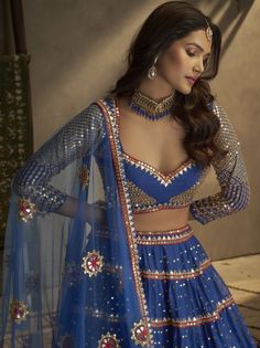 <ul>
<li style="text-align: justify;"><span data-preserver-spaces="true">Let your elegance reflect and get compliments with this beautiful blue color lehenga choli. This blue lehenga is made of georgette material beautified with sequins work, mirror work, and thread embroidered.</span></li>
<li style="text-align: justify;"><span data-preserver-spaces="true">This lehenga comes with a similar color georgette material blouse designed with sequins work, mirr Blue Sheer Dupatta Set For Navratri, Blue Sharara For Navratri Festival, Blue Sharara For Navratri Festive Occasion, Blue Sharara For Navratri Festivities, Blue Sharara For Diwali Festivities, Blue Anarkali Choli With Sheer Dupatta, Blue Georgette Sharara For Diwali, Blue Georgette Sharara For Reception, Blue Bollywood Lehenga For Festive Occasions