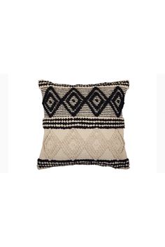 a black and white pillow on a white background