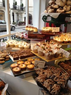 an assortment of pastries and desserts on display