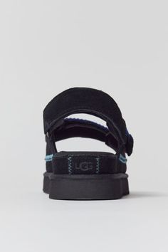 Crafted from velvety suede, these UGG sandals offers wear-with-everything style. Two sets of adjustable straps provide a fine-tuned fit, while the contoured foam footbed and Treadlite by UGG™ outsole deliver all-day cushion and support. Content + Care Suede, EVA, rubber Spot clean Imported Size + Fit Platform: 1.25" h Heel: 1.75" h | UGG Goldenstar Embroidered Suede Sandal in Black, Women's at Urban Outfitters Ugg La Cloud Sandal, Ugg Sandals, Cozy Boots, Suede Sandals, Sandal Fashion, Urban Outfitters, Adjustable Straps, Slippers, In Store