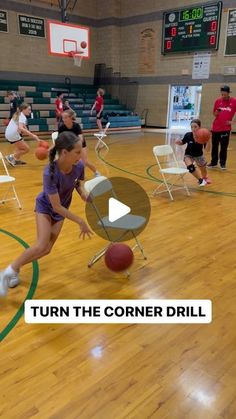 a group of people in a gym playing with a ball and basketball on the court