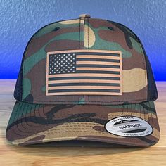 American Flag Patriotic SnapBack Trucker Patch Hat Camo/Black Hat Rawhide Patch Specifications: 🧢 SnapBack Trucker Hat; adjustable for the perfect fit 🎩 Cotton/polyester blend for comfort 📏 One size fits most 🏷️ Expertly laser engraved leatherette patch design 📦 Ships in 2 to 3 business days from our Orlando Studio Care Instructions: 🚫 Do not wash; spot clean only Please Note: 🌈 Colors may vary from photos based on your viewing screen. Black Military Summer Hat, Military Style Black Adjustable Trucker Hat, Adjustable Black Military Trucker Hat, Black Adjustable Military Trucker Hat, Military Style Black Adjustable Snapback Hat, Adjustable Black Military Snapback Hat, Black Adjustable Military Snapback Hat, Black Patriotic Adjustable Baseball Cap, Black Adjustable Patriotic Baseball Cap