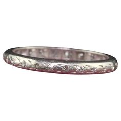 Beautiful Antique Art Deco Platinum Single Cut Diamond Engraved Eternity Band - Size 5 1/2. This beautiful wedding band is crafted in platinum. The ring has deep set single cut diamonds that go around the entire ring. The ring is in fair condition with no structural issues and sits low on the finger. Item #R1655 Metal: Platinum Weight: 2.3 Grams Size: 5 1/2 Diamonds: Approximately .15 cts Color: H - I Clarity: VS2 - SI1 Measurements: Top of the ring measures 2.25 mm wide and band measures 2.25 mm wide. Measurements off the finger: 1.43 mm high Layaway: For your convenience, we will be happy to provide layaway payment options. Please contact us to work out a layaway plan which best suits your needs. All layaway purchases are final sale. All domestic and international shipments are shipped w Beautiful Wedding Bands, Art Deco Diamond, Antique Art Deco, Eternity Band, Cool Suits, Eternity Bands, Antique Art, Beautiful Weddings, Band Rings