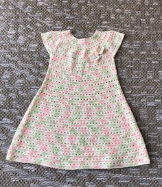 "Girl dress in pastel colors, white, pink and green. Dress is made with cotton and viscose yarn  Measurments: Dress fits for 2-4 years old girl ( based on the clothing size girl is wearing , some girls are smaller and some are bigger.  Dress measure: From neck total length 21\", around the waste 24\" I have the same dress, just smaller, please see my other listing Hand wash in warm water and dry flat" Handmade Fitted Pink Dress, Cute Handmade Pink Dress, Handmade Pink Dress For Spring, Handmade Pink Dresses For Spring, White Crochet Dresses For Spring, Spring Crochet Sundress, Handmade Multicolor Dresses For Spring, Green Crochet Sleeveless Dress, Green Sleeveless Crochet Dress