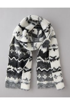 a black and white scarf on a gray background